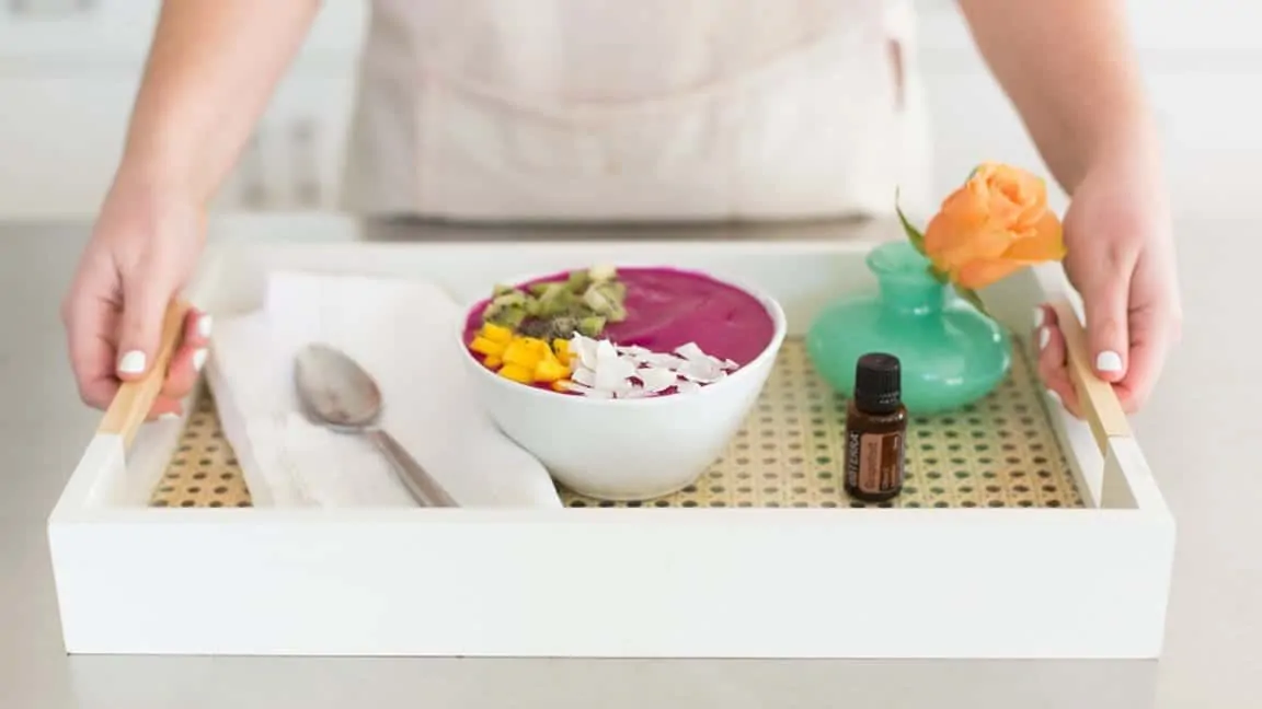 pitaya smoothie bowl on platter with doterra grapefruit essential oil