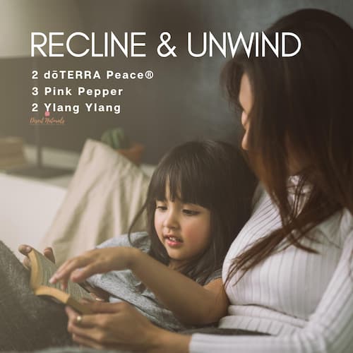 mother and daughter reading and text with a sleep diffuser blend