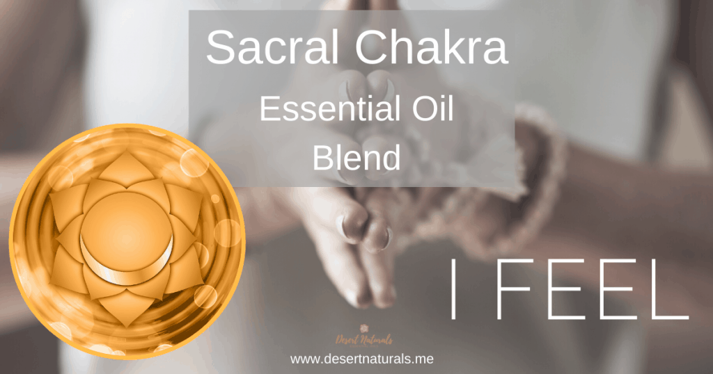 woman's hands in prayer position with sacral chakra symbol and text Sacral Chakra Essential Oil Blend, I Feel