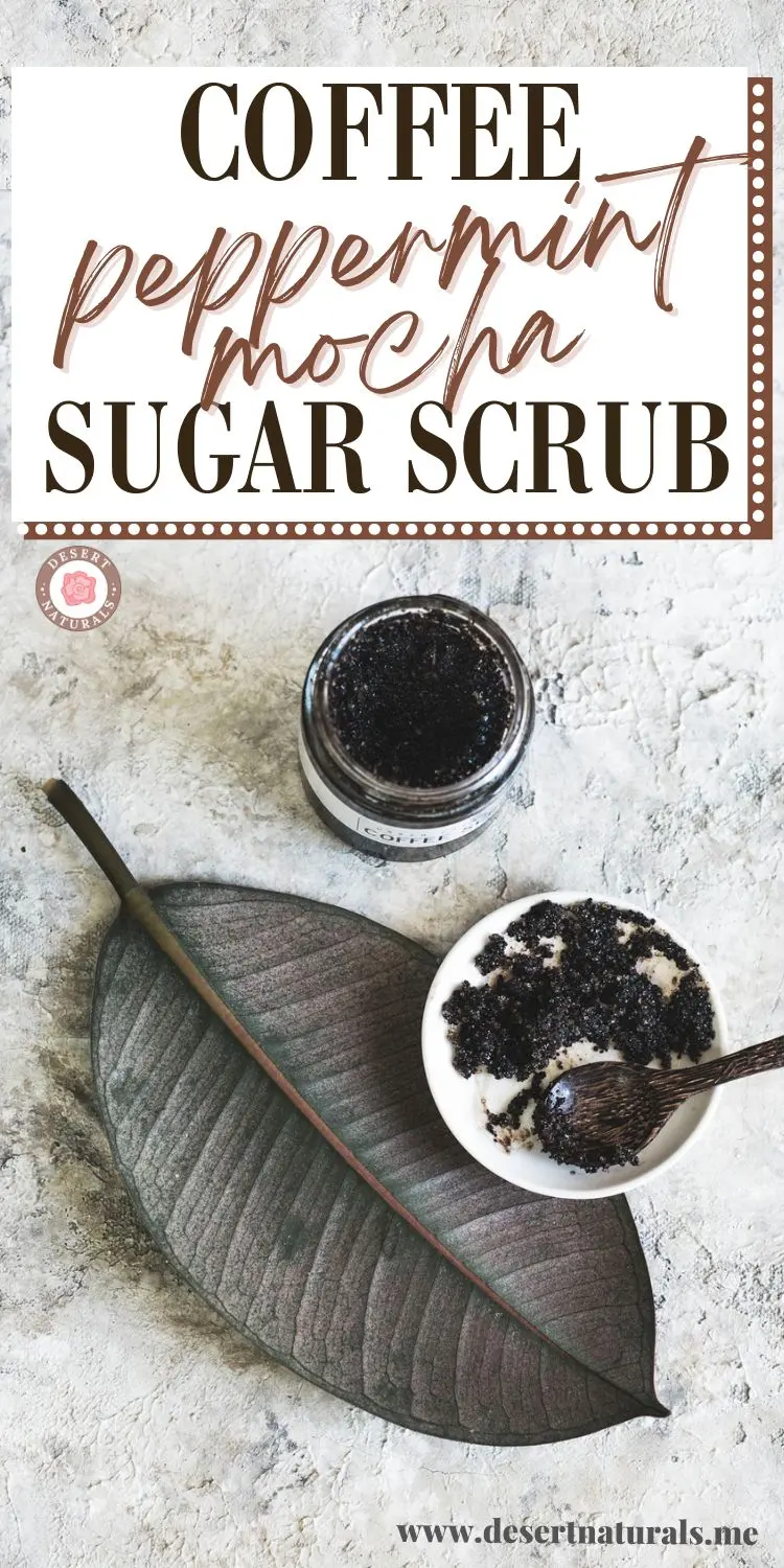 bowl of homemade coffee scrub with a wooden spoon on a pretty leaf