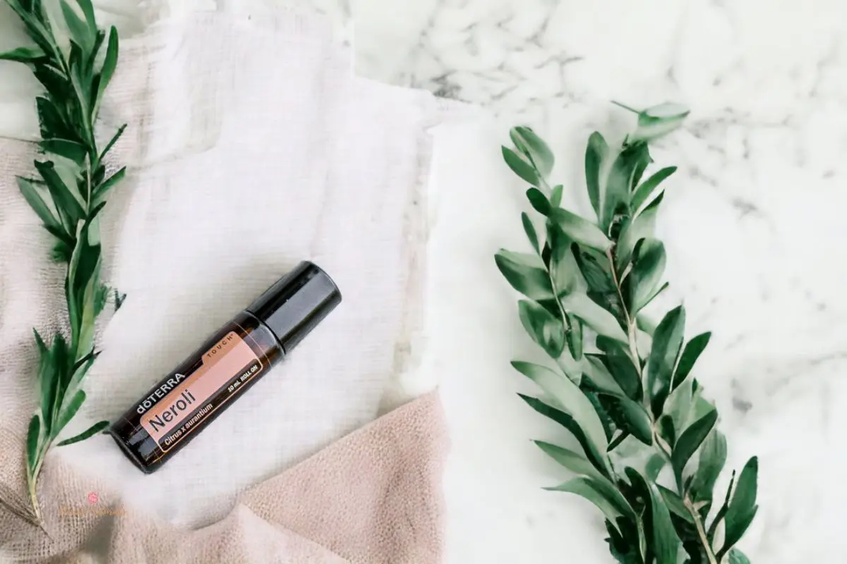 flatlay boho style photo of doterra neroli essential oil roller