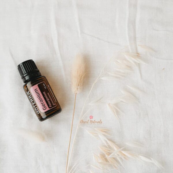 photo of doterra geranium essential oil with dried plant in background