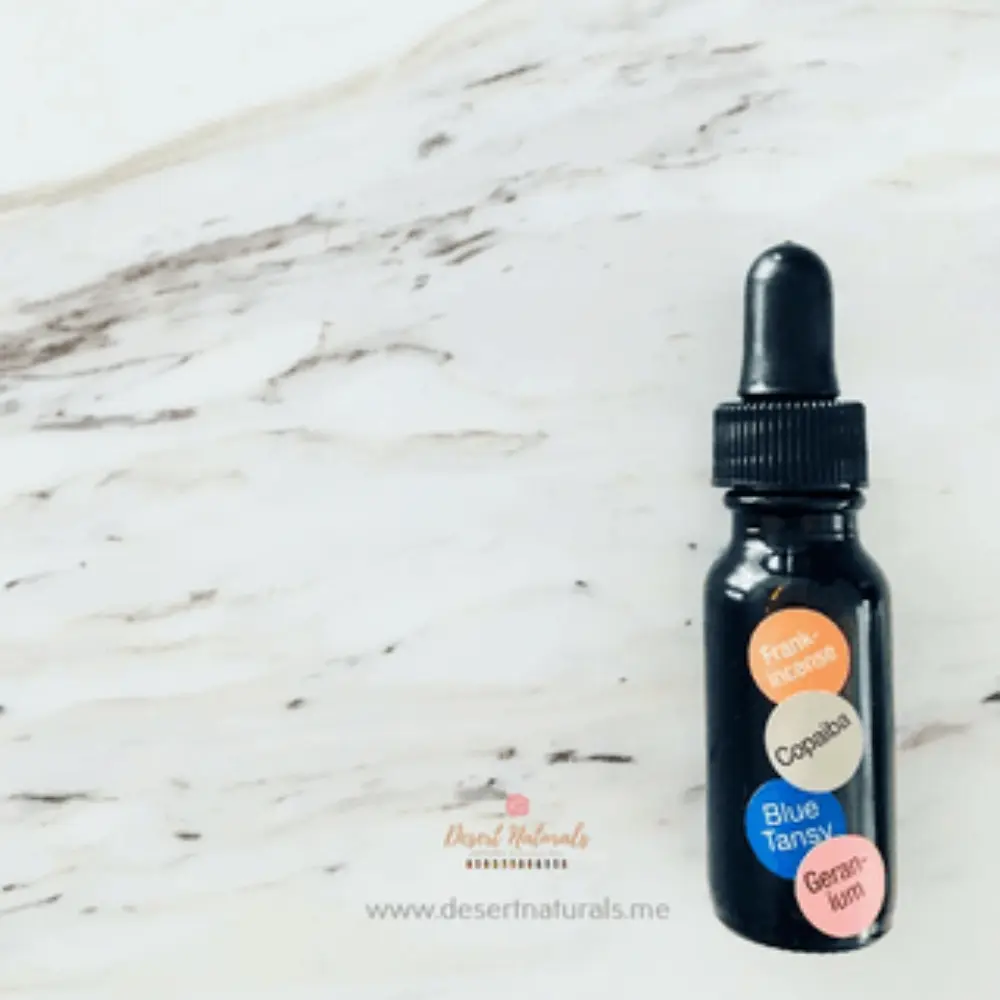 dropper bottle of diy face serum with essential oils