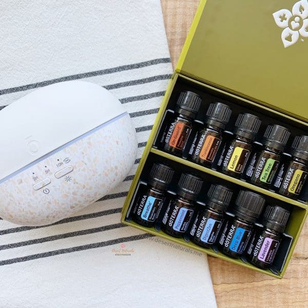 flat lay of doterra healthy start kit in box with the diffuser
