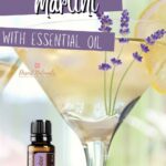 image of martini glass with lemons and lavender and the text lemon lavender martini with a bottle of doterra essential oil
