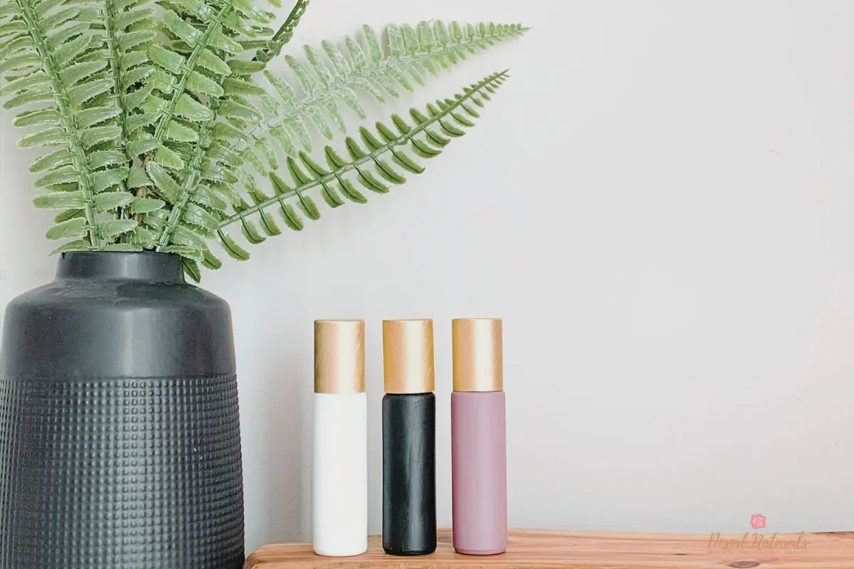 essential oil roller bottles with plant