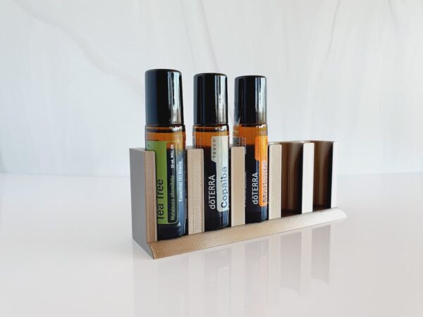 white background with photo of 3d printed essential oil storage stand and doterra rollerballs