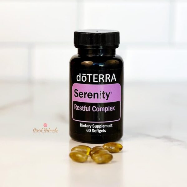 bottle of doTERRA serenity complex on a counter with several softgels