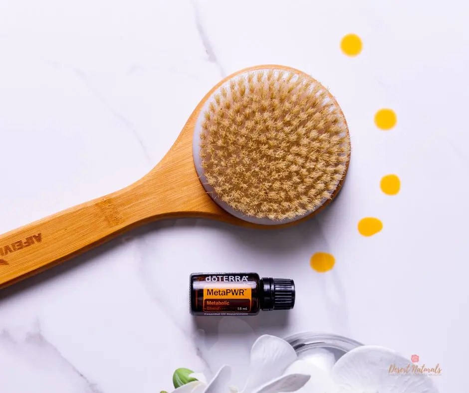 doterra metapwr essential oil with a dry brush