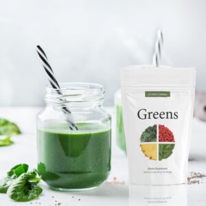 image of doterra greens package and smoothie in a glass