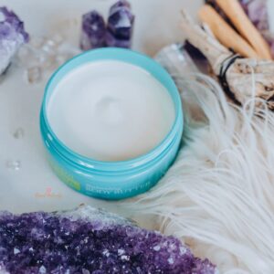 image of open container of doterra spa body butter with amethyst crystal