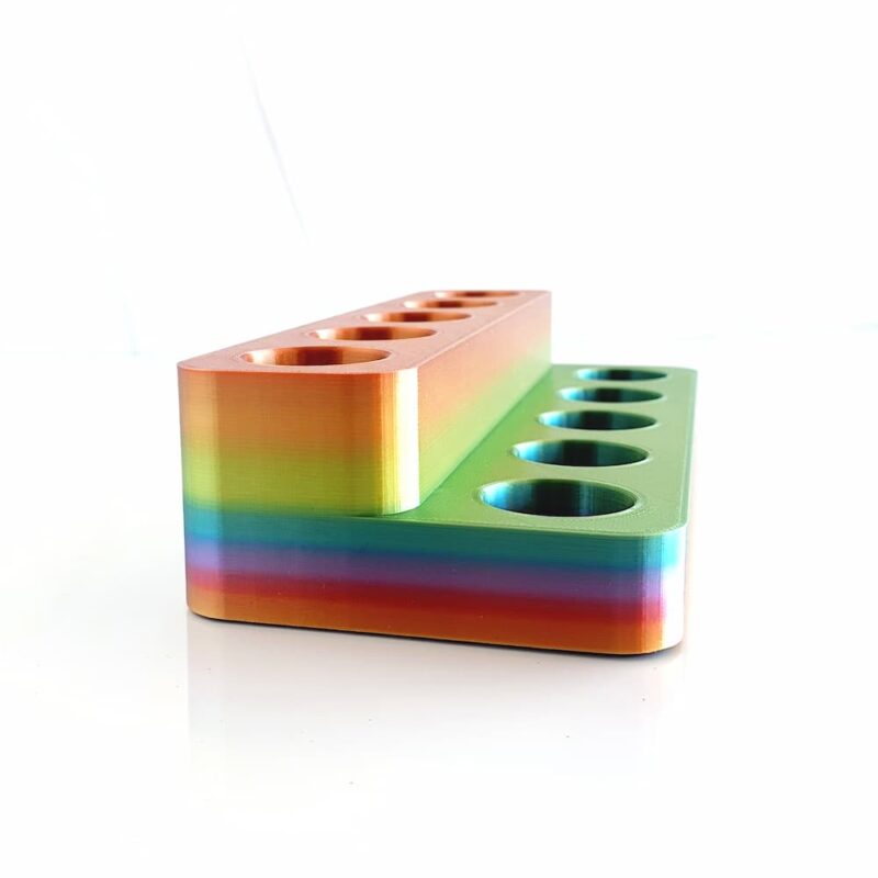white background with photo of 2 tier essential oil shelf in rainbow