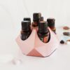 image of rose gold essential oil holder for 15ml bottles with white background