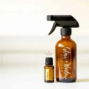 make your own glass and window cleaner with lemon essential oil and natural ingredients