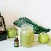 blender and green smoothie with doterra celery seed essential oil
