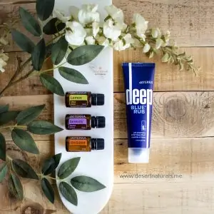 doterra simple solutions kit with deep blue rub and 3 essential oils on wood and white plate with eucalyptus