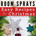 Brown essential oil spray bottles with Christmas tree cuttings and silver gilttery star