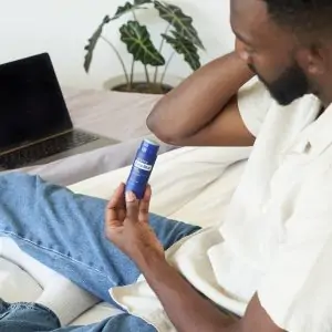 man using doterra deep blue stick on his elbow