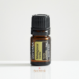 5ml bottle of doTERRA Vanilla essential oil on neutral background