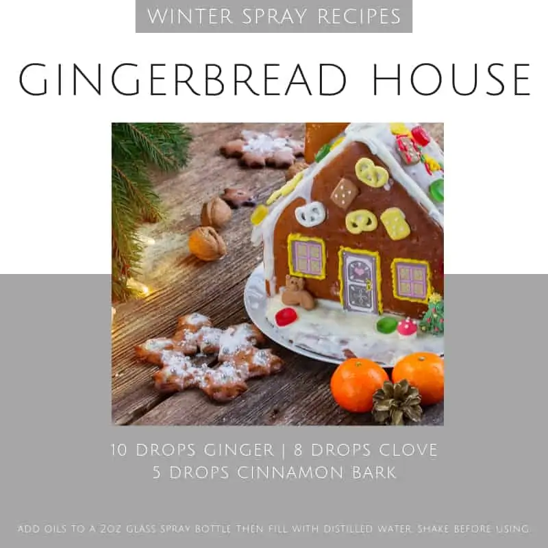 a decorated gingerbread house with an essential oil spray recipe.