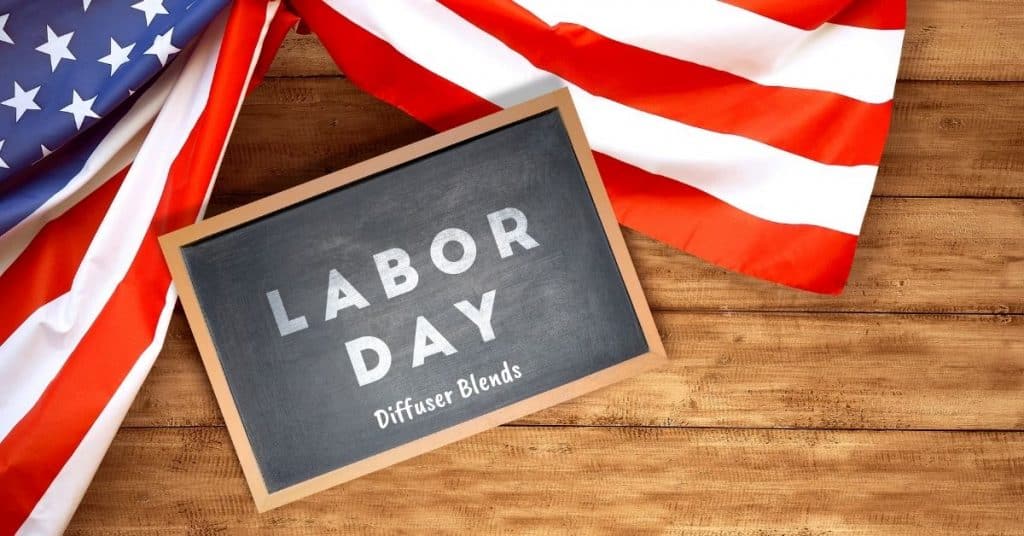 wood background with us flag and chalkboard with text Labor Day diffuser blends