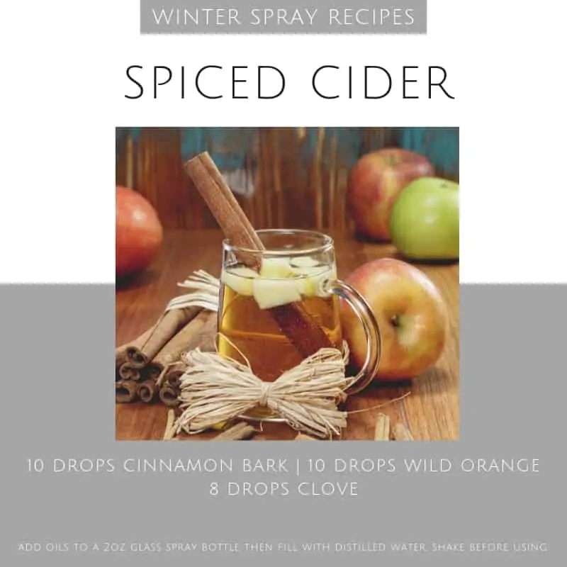 black and grey background with imageof spiced apple cider with apples surring it and recipe for essential oil room spray