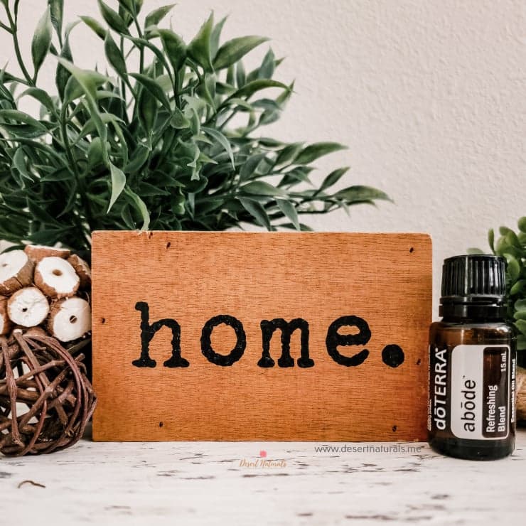 doterra abode essential oil with wooden home sign