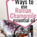 amethyst crystal with bottle of doterra roman chamomile essential oil and text
