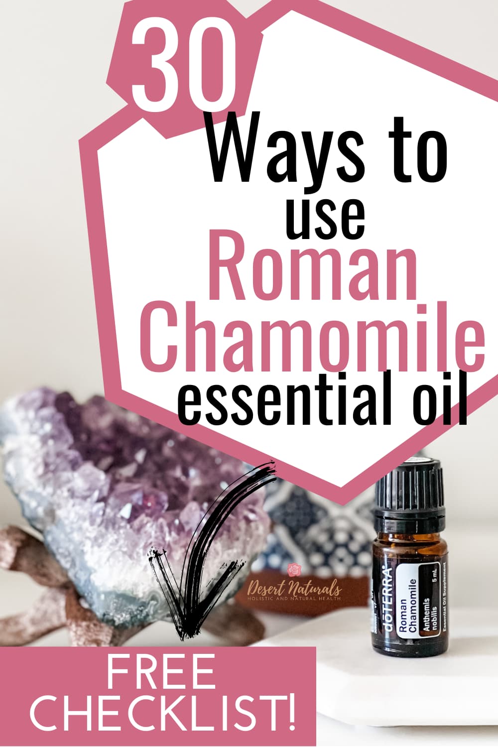 amethyst crystal with bottle of doterra roman chamomile essential oil and text