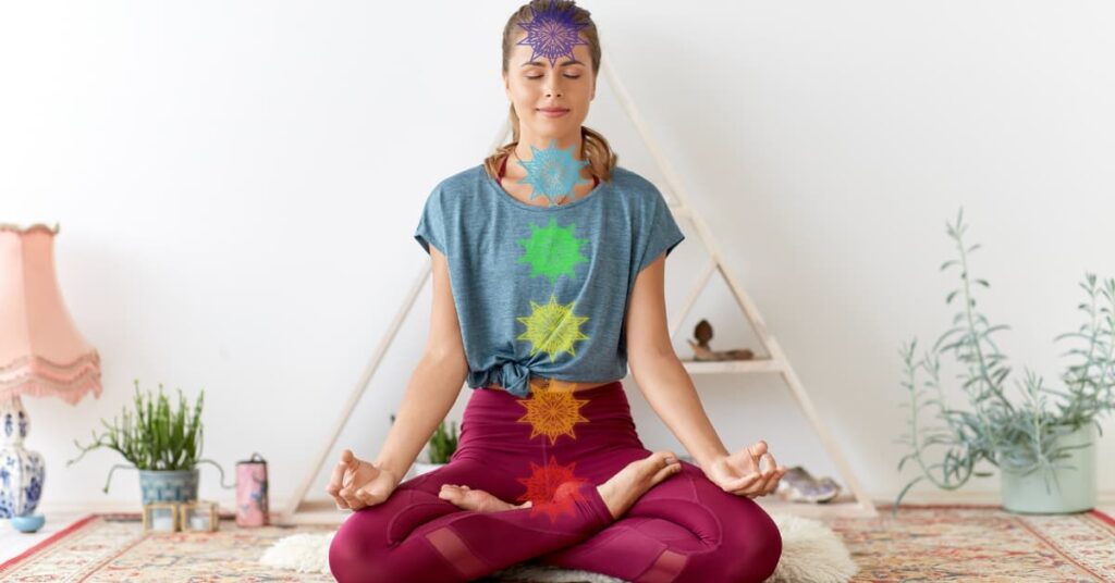 woman meditation with the 7 chakras symbols aligned on her body