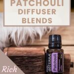 beautiful image of a bottle of doterra patchouli essential oil on wood and fur and text Patchouli diffuser blends