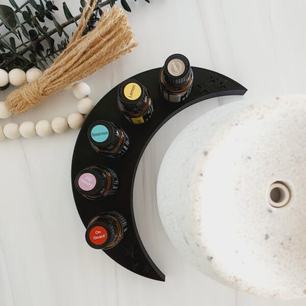 black moon essential oil holder with doterra oil bottles, eucalyptus, beads and diffuser