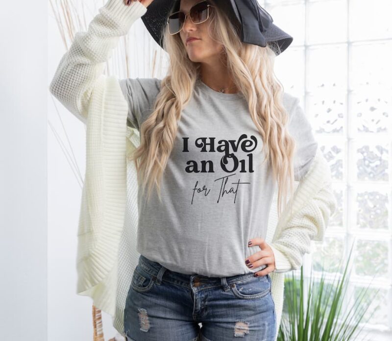 woman wearing I have an oil for that shirt in grey