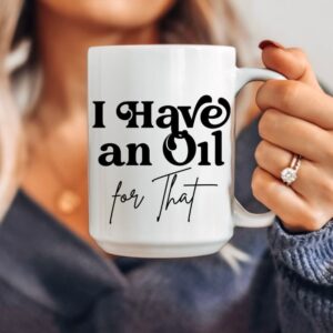 woman holding an I Have an Oil for That essential oil mug