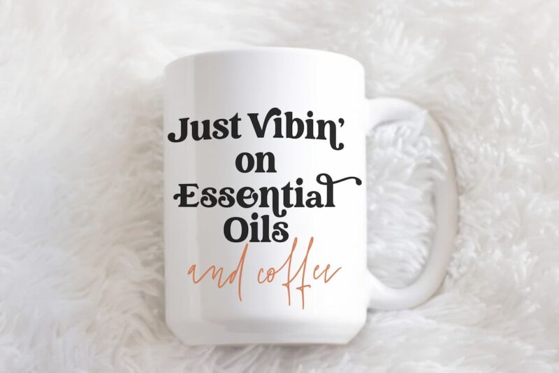 image of essential oil mug on white fur. Just Vibin on Essential Oils and coffee