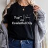 woman wearing black t shirt that says just vibin on essential oils