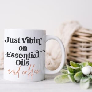 image of mug with the quote just vibin on essential oils and coffee