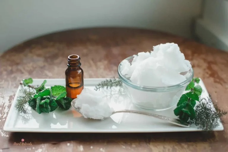 jar of coconut oil with bottle of essential oil for oil pulling