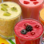 brightly colored essential oil fruit smoothies