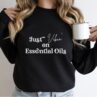 woman modeling just vibin on essential oils sweatshirt