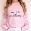 woman modeling pink just vibin on essential oils sweatshirt