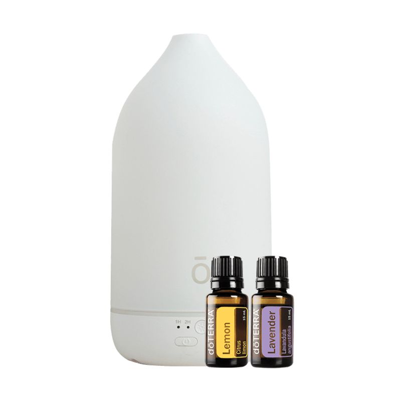 white background with doterra essential oil diffuser and bottles of lemon and lavender