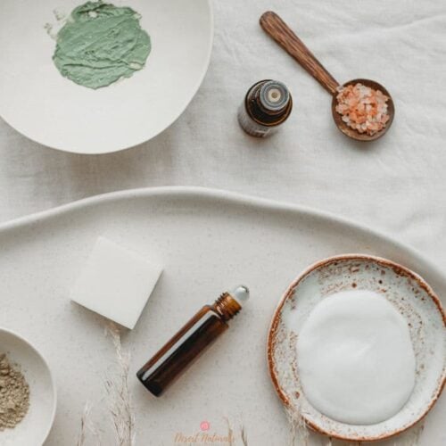 essential oil rollerballs and bowls of homemade skin care