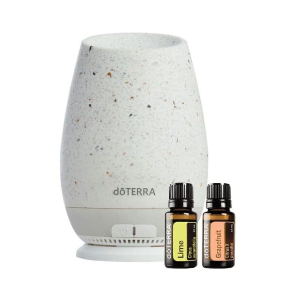 white background with roam diffuser and bottles of doterra lime and grapefruit essential oil