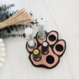 image of dog paw essential oil holder in rose gold with eucalyptus sprigs