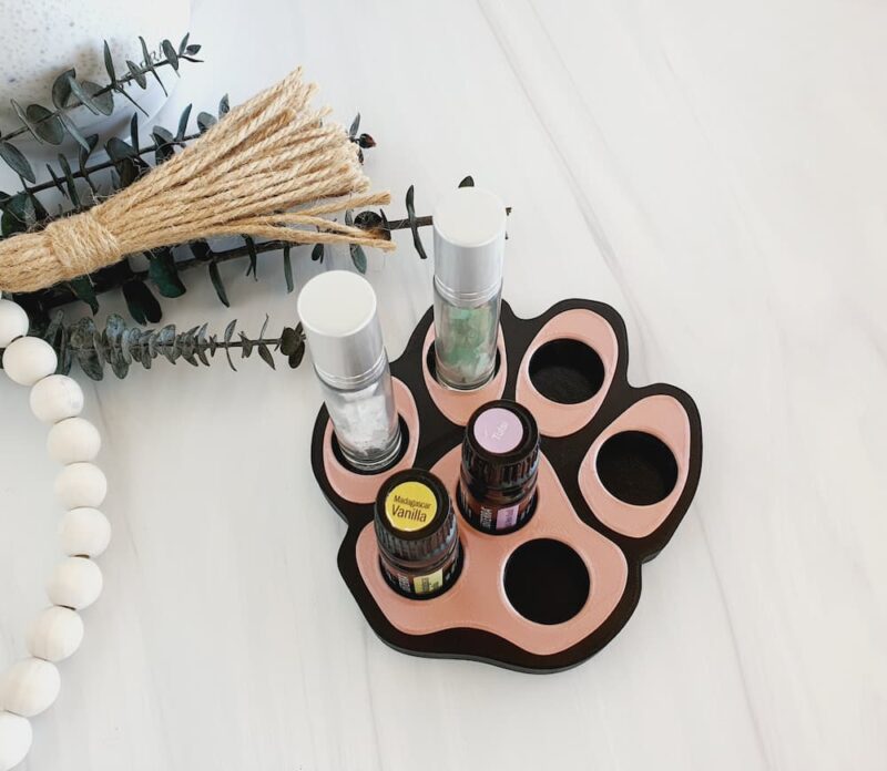 image of dog paw essential oil holder in rose gold with eucalyptus sprigs