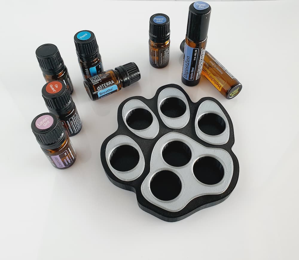 dog paw essential oils stand with doTERRA oil bottles and rollers