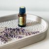 image of bottle of doterra petitgrain on tray with dried lavender