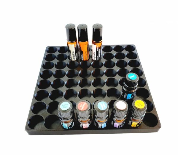 white background with image of essential oil display shelf holding doterra bottles and rollers