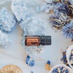 photo of doterra arborvitae essential oil with crystals and dried plants